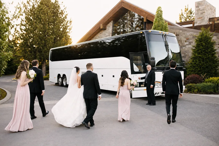 Wedding party boarding a luxury coach